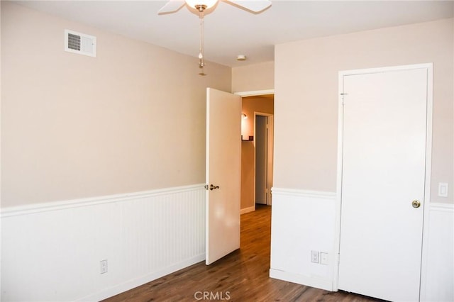 6584 E Paseo Diego, Anaheim, CA 92807 - unfurnished bedroom featuring wainscoting, wood finished floors, and a ceiling fan