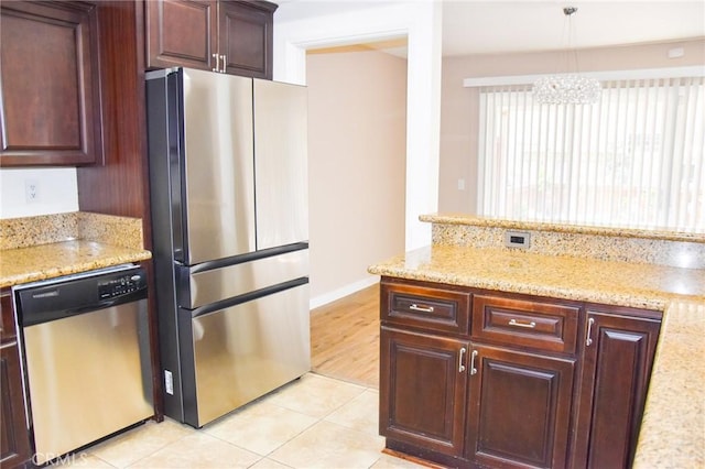 6584 E Paseo Diego, Anaheim, CA 92807 - kitchen featuring stainless steel appliances, light tile patterned floors, light stone countertops, and dark brown cabinets