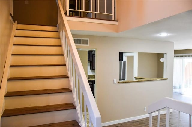 6584 E Paseo Diego, Anaheim, CA 92807 - staircase with wood finished floors and baseboards