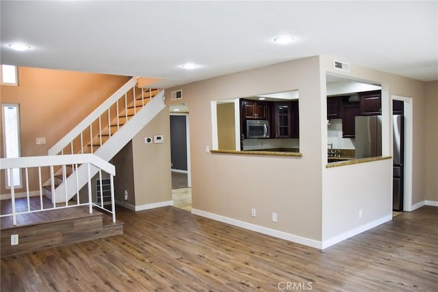 6584 E Paseo Diego, Anaheim, CA 92807 - unfurnished living room featuring stairway, wood finished floors, and recessed lighting