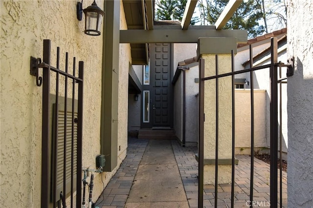 6584 E Paseo Diego, Anaheim, CA 92807 - exterior space featuring stucco siding and a gate