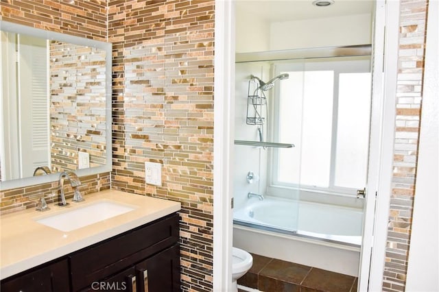 6584 E Paseo Diego, Anaheim, CA 92807 - bathroom with vanity, bath / shower combo with glass door, and tasteful backsplash