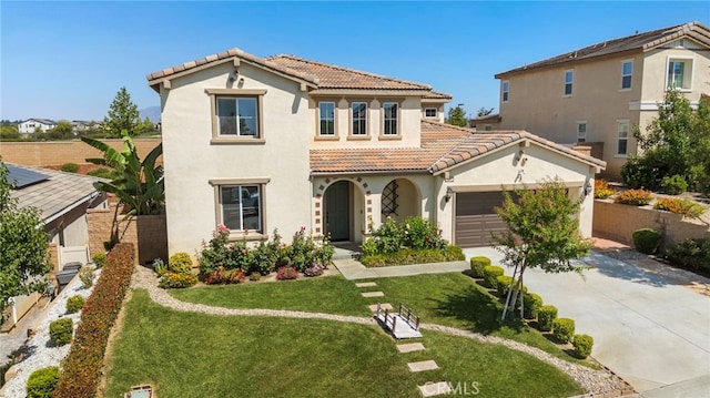 11462 Jacobsen Rd, Beaumont, CA 92223 - mediterranean / spanish house with a tile roof, stucco siding, concrete driveway, and a front lawn