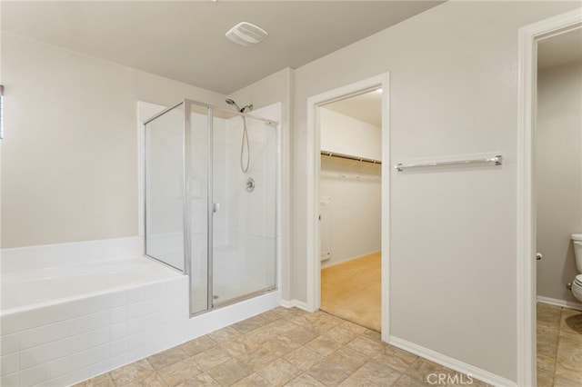 11462 Jacobsen Rd, Beaumont, CA 92223 - full bathroom featuring a shower stall, a bath, and a spacious closet