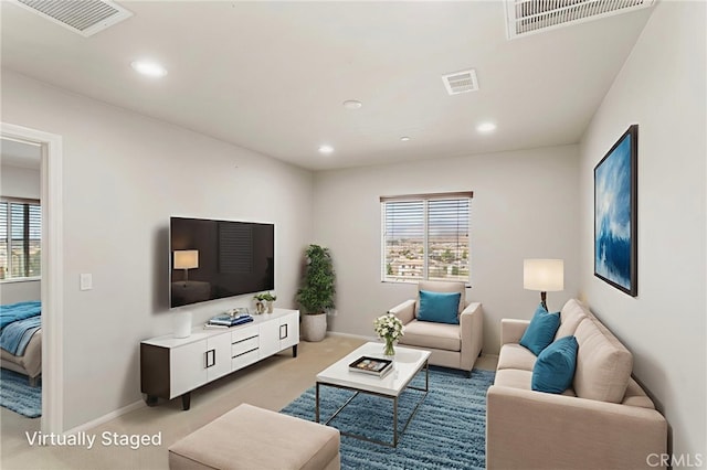 11462 Jacobsen Rd, Beaumont, CA 92223 - living room featuring healthy amount of natural light, carpet floors, and recessed lighting