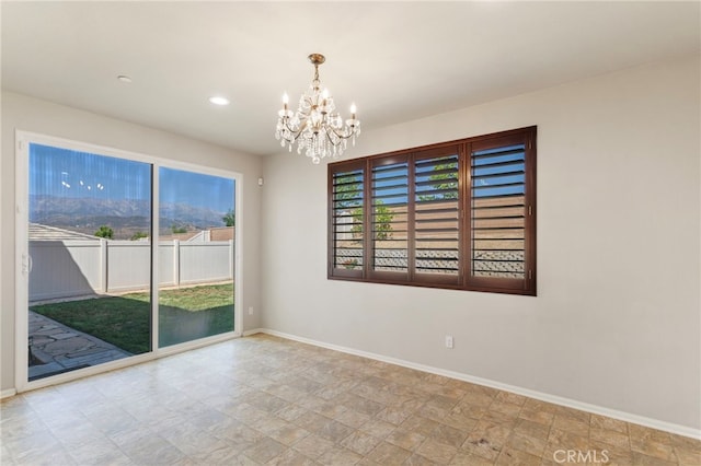 11462 Jacobsen Rd, Beaumont, CA 92223 - unfurnished room with a chandelier, recessed lighting, and stone finish flooring