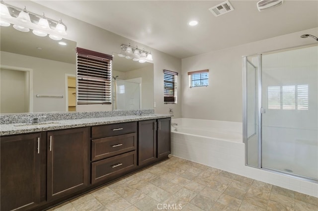 11462 Jacobsen Rd, Beaumont, CA 92223 - full bath with a stall shower, double vanity, and a bath