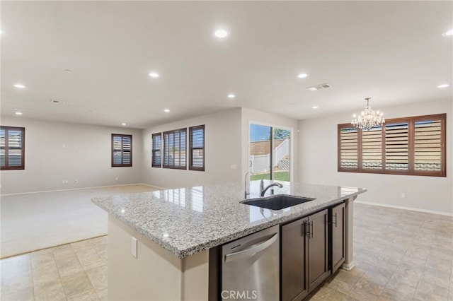 11462 Jacobsen Rd, Beaumont, CA 92223 - kitchen with dishwasher, recessed lighting, open floor plan, an island with sink, and light stone countertops