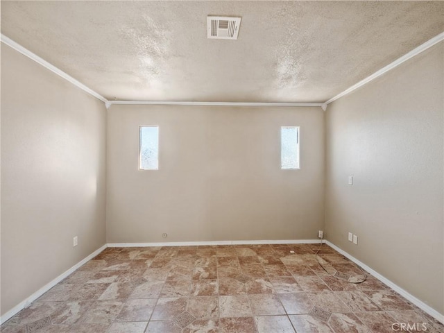 7423 Palomar Ave, Yucca Valley, CA 92284 - empty room with plenty of natural light, ornamental molding, a textured ceiling, and stone finish floors