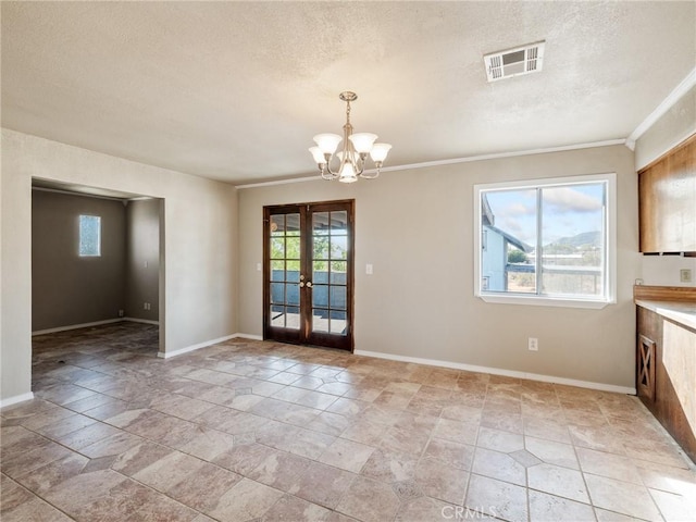 7423 Palomar Ave, Yucca Valley, CA 92284 - unfurnished dining area featuring a textured ceiling, a chandelier, french doors, light stone finish flooring, and ornamental molding