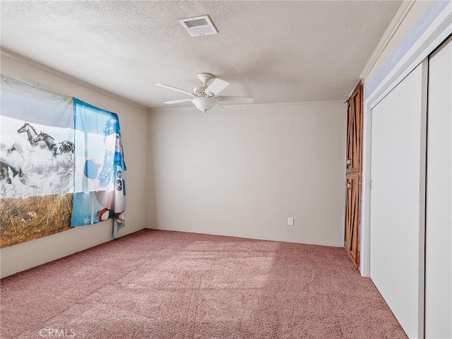 7423 Palomar Ave, Yucca Valley, CA 92284 - carpeted spare room with a textured ceiling, ceiling fan, and ornamental molding