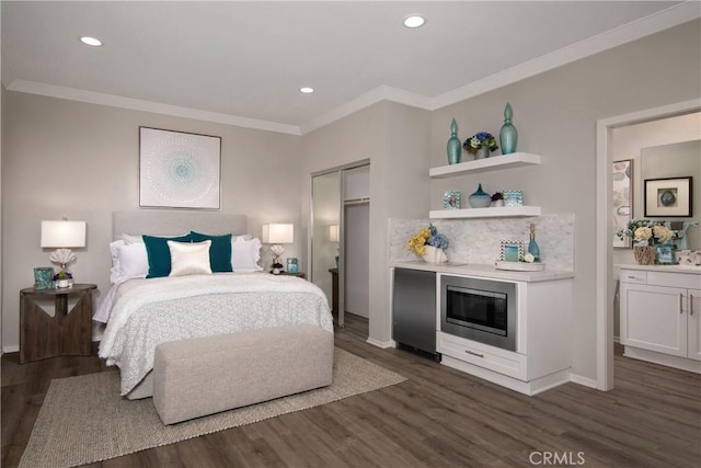 9031 Carson Ave, Hesperia, CA 92344 - bedroom with dark wood-style floors, ornamental molding, recessed lighting, a closet, and refrigerator