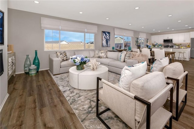 9031 Carson Ave, Hesperia, CA 92344 - living room featuring light wood-style floors and recessed lighting
