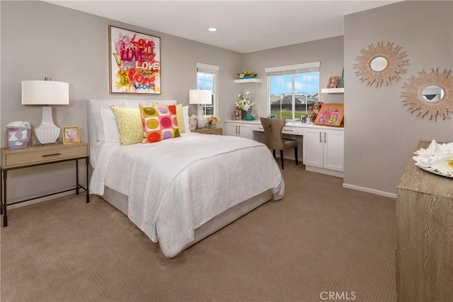 9031 Carson Ave, Hesperia, CA 92344 - bedroom featuring light colored carpet and built in desk