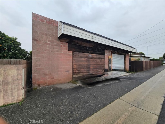18119 S Denker Ave, Gardena, CA 90248 - view of property exterior with a garage