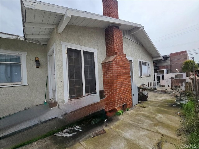 18119 S Denker Ave, Gardena, CA 90248 - view of property exterior featuring stucco siding and a chimney