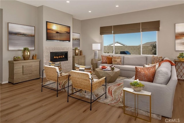 9048 Carson Ave, Hesperia, CA 92344 - living area with light wood-style flooring, a tile fireplace, and recessed lighting