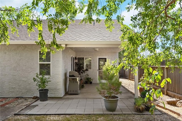 1 Alden Ct, Chico, CA 95973 - back of house with stucco siding, roof with shingles, a fenced backyard, and a patio area