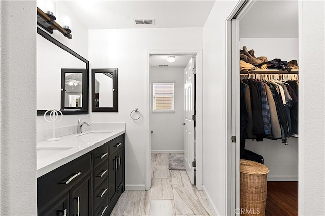 1 Alden Ct, Chico, CA 95973 - bathroom featuring double vanity and a spacious closet