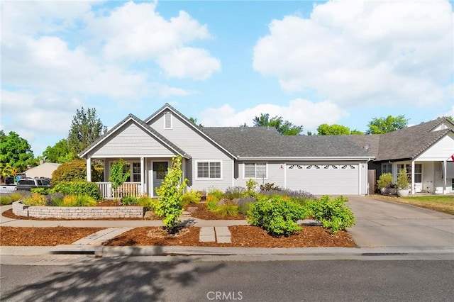 1 Alden Ct, Chico, CA 95973 - view of front of house featuring a garage, driveway, and a porch