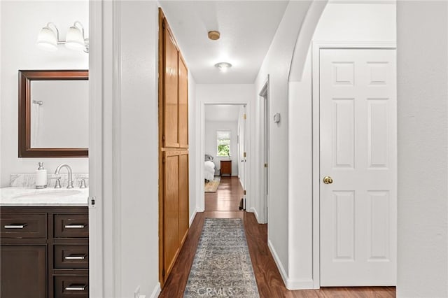1 Alden Ct, Chico, CA 95973 - hallway featuring a sink and dark wood-type flooring