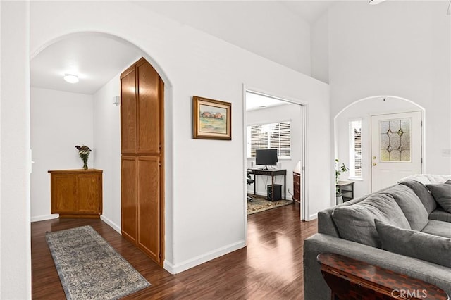 1 Alden Ct, Chico, CA 95973 - living area featuring arched walkways, dark wood-type flooring, and a desk