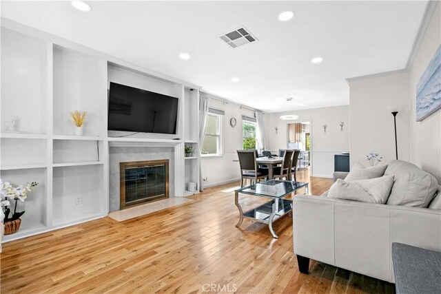 3348 Burritt Way, La Crescenta, CA 91214 - living room featuring recessed lighting, wood finished floors, a premium fireplace, and built in shelves