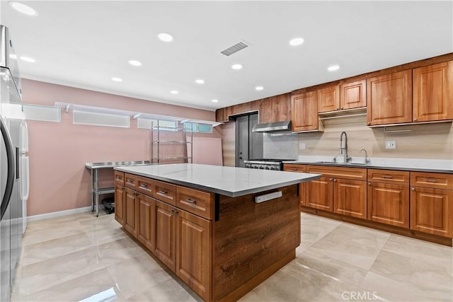 3348 Burritt Way, La Crescenta, CA 91214 - kitchen featuring a kitchen island, brown cabinets, recessed lighting, tasteful backsplash, and ventilation hood