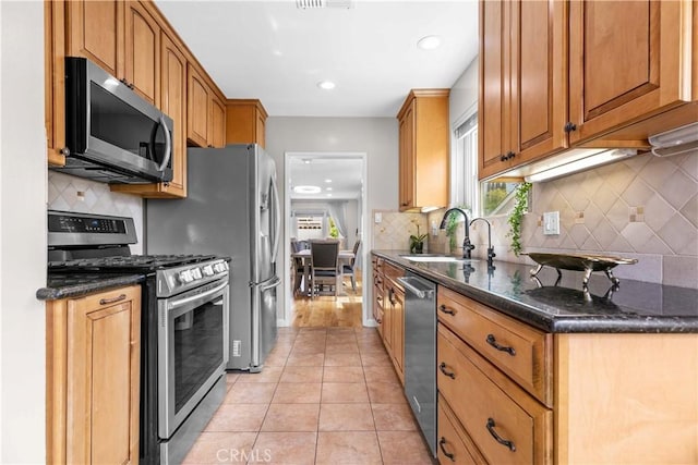 3348 Burritt Way, La Crescenta, CA 91214 - kitchen featuring stainless steel appliances, plenty of natural light, tasteful backsplash, and recessed lighting