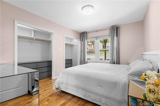 3348 Burritt Way, La Crescenta, CA 91214 - bedroom with multiple closets and light wood-type flooring