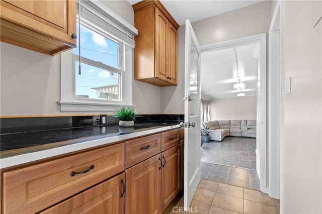 3348 Burritt Way, La Crescenta, CA 91214 - kitchen featuring light tile patterned floors and brown cabinets