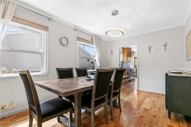 3348 Burritt Way, La Crescenta, CA 91214 - dining space featuring light wood finished floors, ornamental molding, and a chandelier
