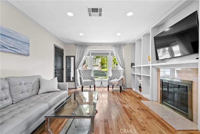 3348 Burritt Way, La Crescenta, CA 91214 - living area with recessed lighting, wood-type flooring, a high end fireplace, and crown molding