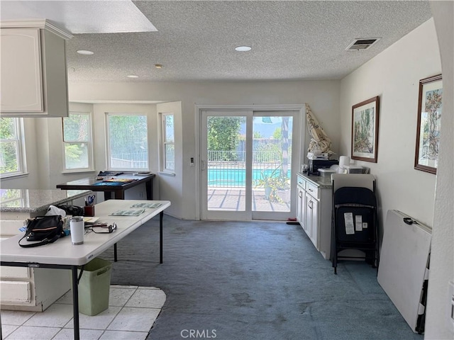 23020 Jensen Ct, Grand Terrace, CA 92313 - office space with plenty of natural light, light colored carpet, and a textured ceiling