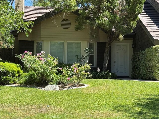 23020 Jensen Ct, Grand Terrace, CA 92313 - view of front of house featuring a chimney and a front lawn