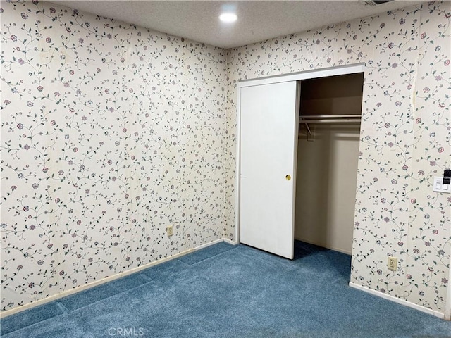 23020 Jensen Ct, Grand Terrace, CA 92313 - unfurnished bedroom featuring carpet, a closet, and wallpapered walls