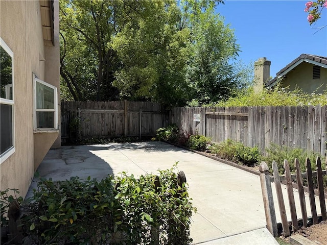 23020 Jensen Ct, Grand Terrace, CA 92313 - fenced backyard featuring a patio area