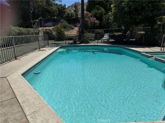 23020 Jensen Ct, Grand Terrace, CA 92313 - view of swimming pool with a pool with connected hot tub