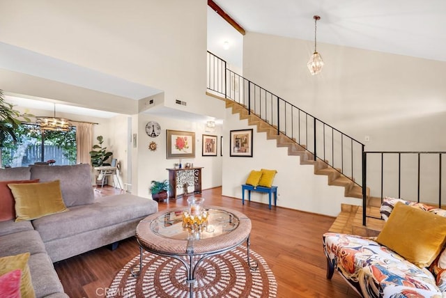 7826 Winnetka Ave, Winnetka, CA 91306 - living room with a chandelier, wood finished floors, stairs, and a high ceiling