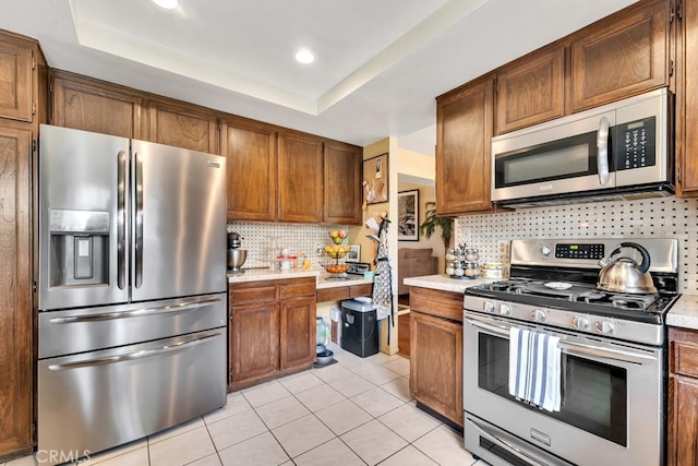 7826 Winnetka Ave, Winnetka, CA 91306 - kitchen featuring appliances with stainless steel finishes, light countertops, tasteful backsplash, and recessed lighting