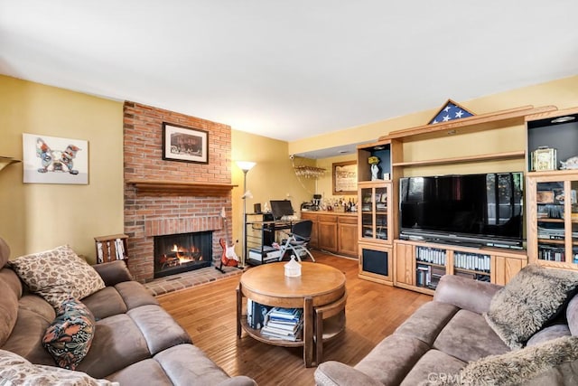 7826 Winnetka Ave, Winnetka, CA 91306 - living room featuring wood finished floors and a fireplace