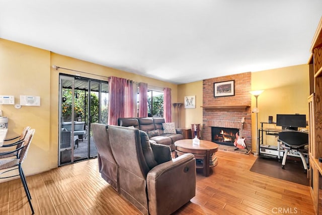 7826 Winnetka Ave, Winnetka, CA 91306 - living area featuring a brick fireplace and wood finished floors