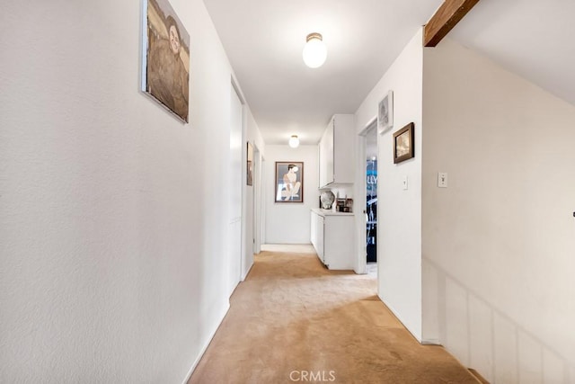 7826 Winnetka Ave, Winnetka, CA 91306 - hallway with light carpet and beam ceiling
