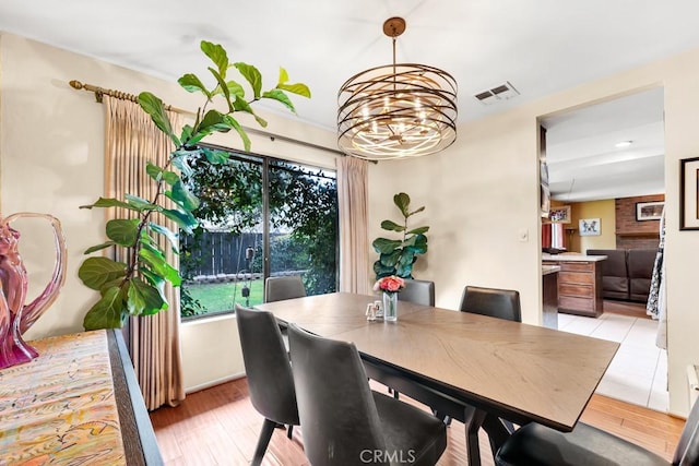 7826 Winnetka Ave, Winnetka, CA 91306 - dining area with a chandelier and light wood-style flooring