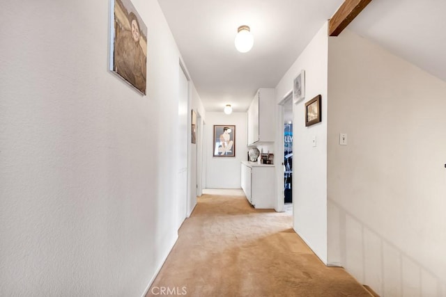 7826 Winnetka Ave, Winnetka, CA 91306 - corridor with light colored carpet and beamed ceiling