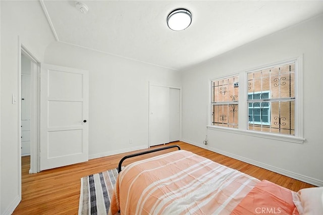 1123 W 81st St, Los Angeles, CA 90044 - bedroom with a closet and wood finished floors