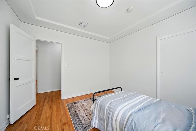 1123 W 81st St, Los Angeles, CA 90044 - bedroom featuring wood finished floors and baseboards
