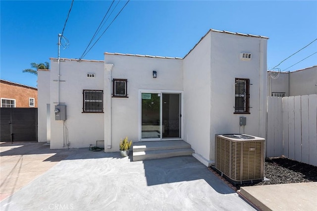 1123 W 81st St, Los Angeles, CA 90044 - rear view of property featuring stucco siding and a patio area