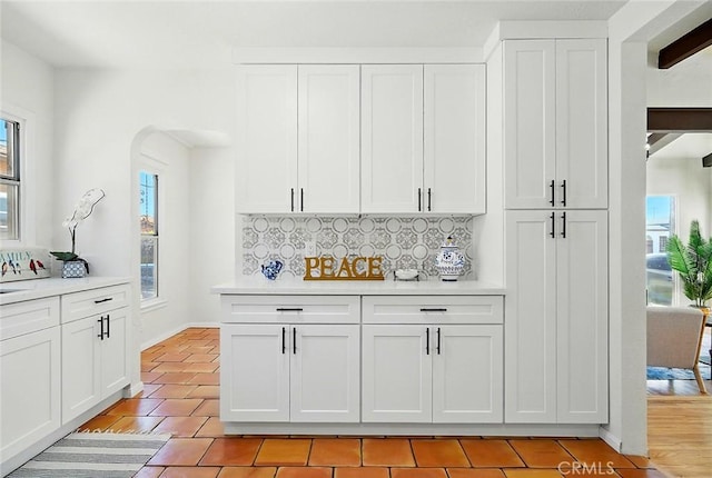 1123 W 81st St, Los Angeles, CA 90044 - kitchen with plenty of natural light, light countertops, and decorative backsplash