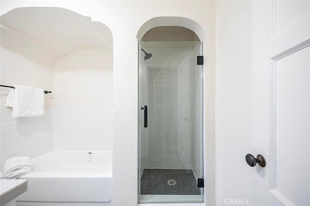 1123 W 81st St, Los Angeles, CA 90044 - full bathroom featuring a stall shower and a tub